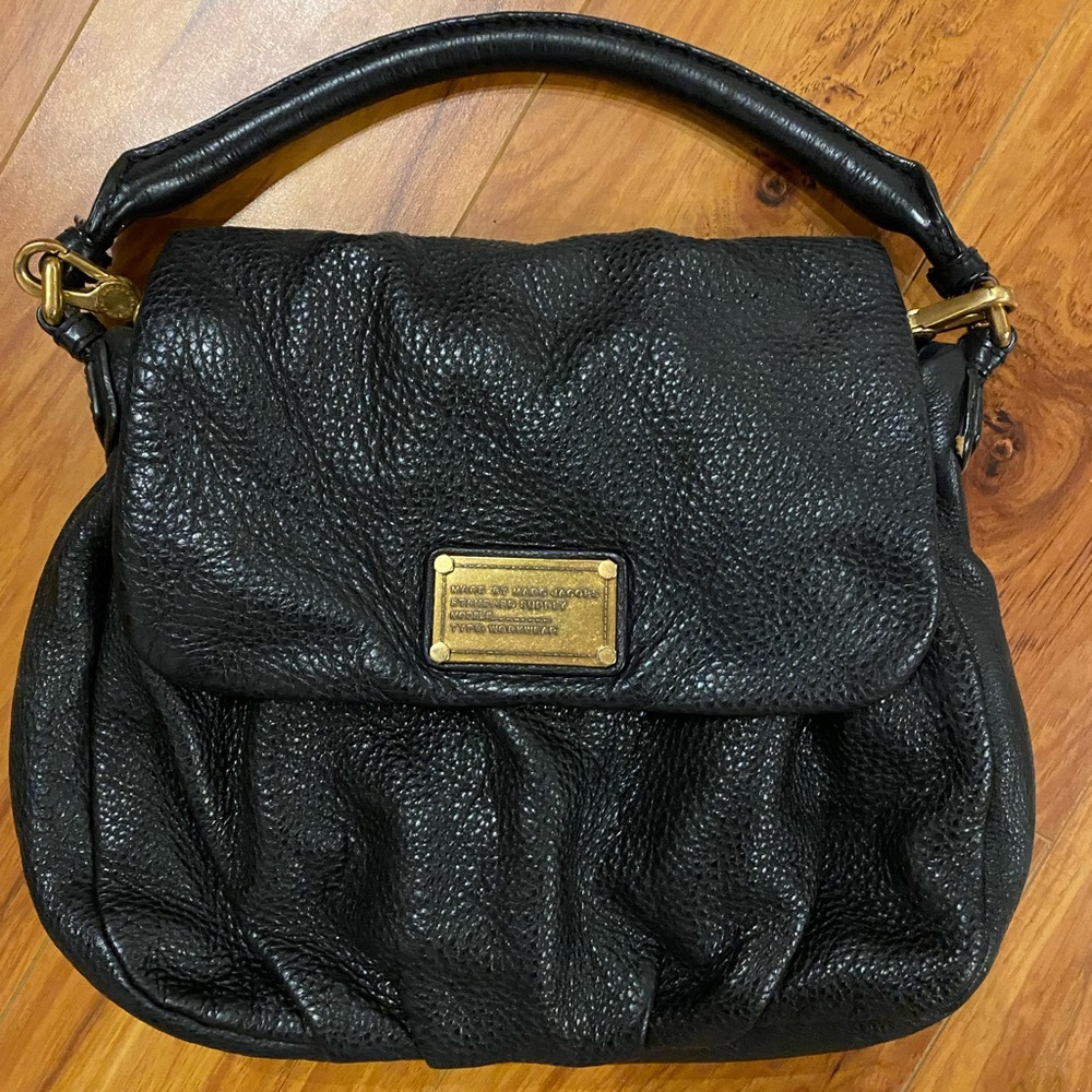 Marc by Marc Jacobs, cross body black bag, with a hand strap or shoulder strap.